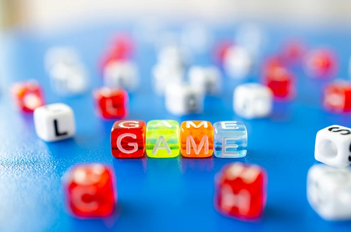 red white yellow and blue plastic dice
